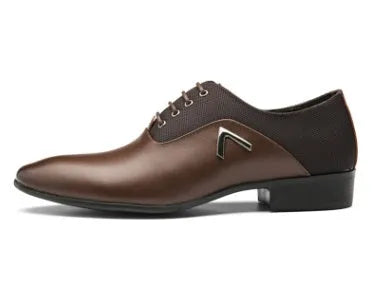 Men's black Oxford shoes with a polished PU upper and durable rubber sole on a wooden floor.