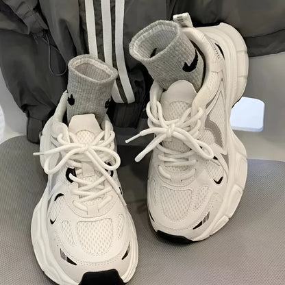 Beige Polar Wave mesh platform trainers with a wedge heel and lace-up front.