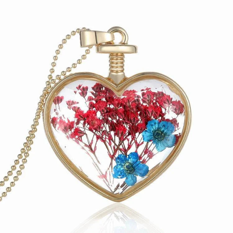 Elegant round pendant necklace with dried flower specimen in various colors including yellow, blue, purple, red, and orange