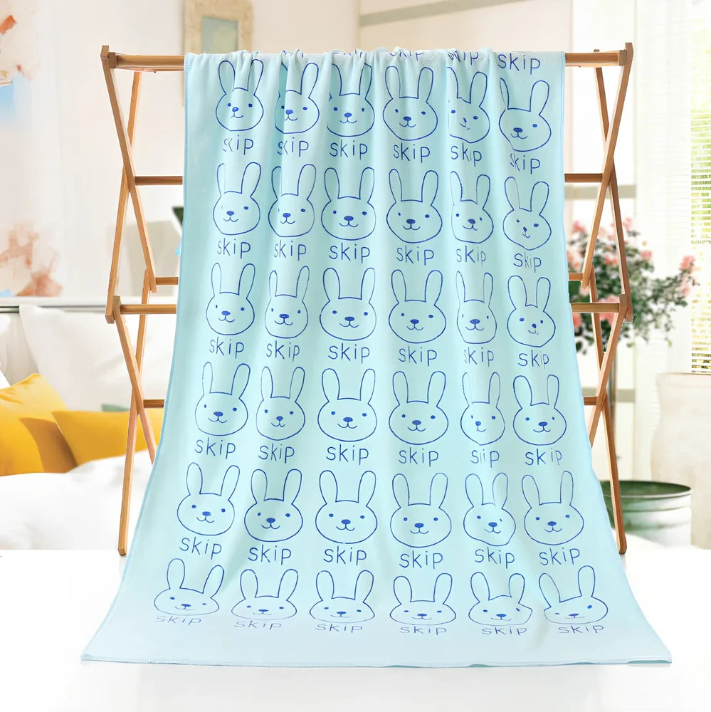 Microfiber bath towel with cartoon character print measuring 70cm wide by 140cm long