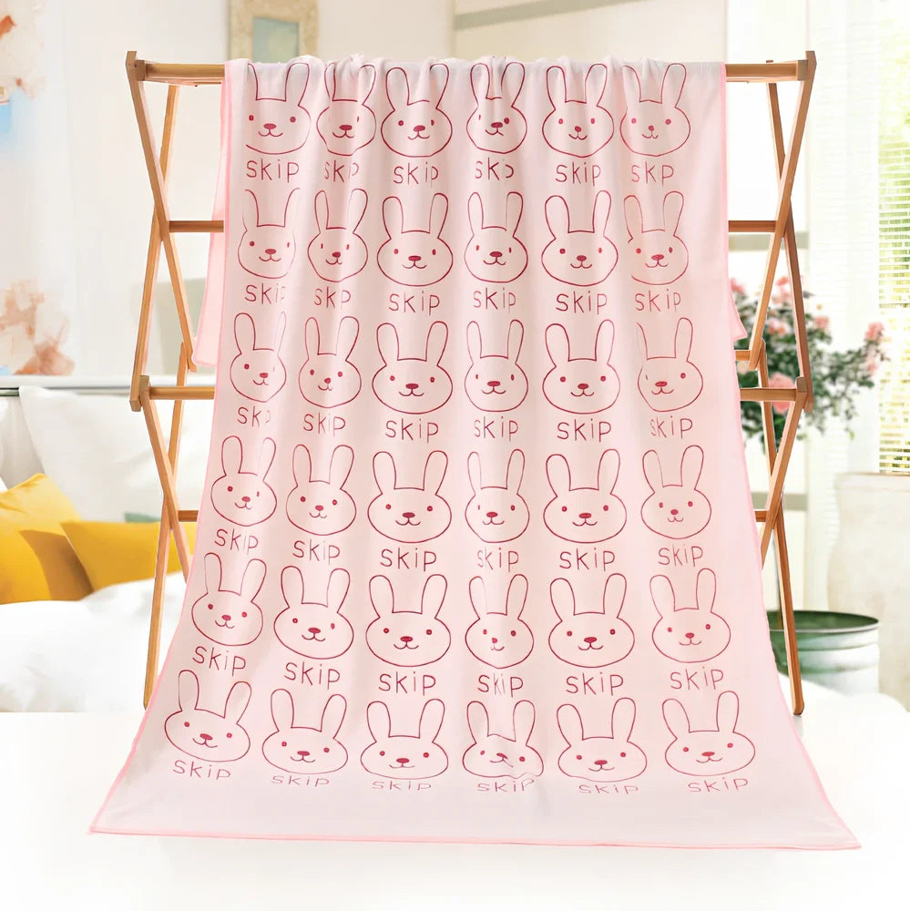Microfiber bath towel with cartoon character print measuring 70cm wide by 140cm long