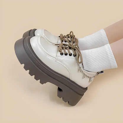 White women's platform Mary Jane shoes with a round toe and thick chunky heel.
