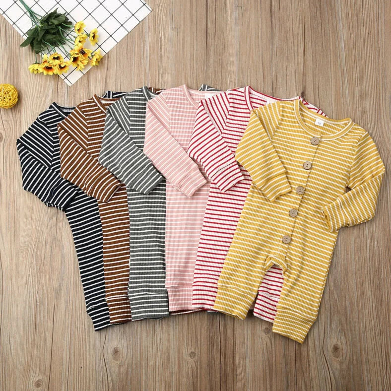 Newborn wearing a striped knitted jumpsuit in cotton, sizes 70-100cm, available in six colours