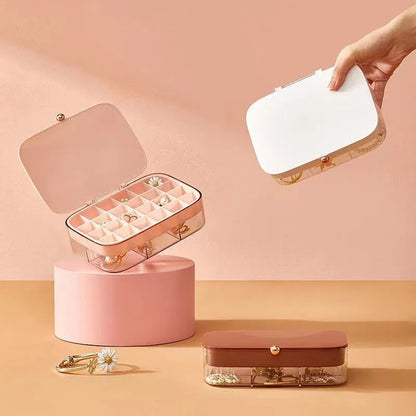 Green multi-layer jewelry storage box with organised compartments for earrings and rings