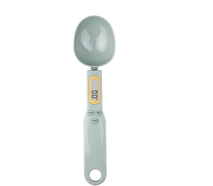 Digital kitchen spoon scale showing measurement display and USB charging port