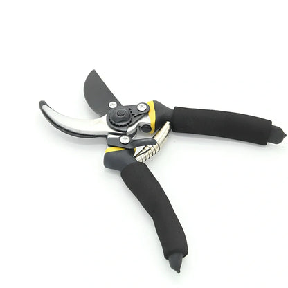 Yellow and green garden shears with 50# steel blades cutting 30mm branches