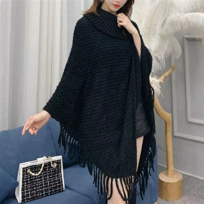Women's triangle shawl cape in cashmere blend fabric with tassel details, shown draped over shoulders
