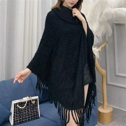 Women's triangle shawl cape in cashmere blend fabric with tassel details, shown draped over shoulders