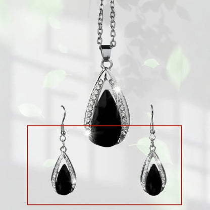Black red teardrop glass pendant necklace and earrings suite with water droplet design elements on alloy jewellery