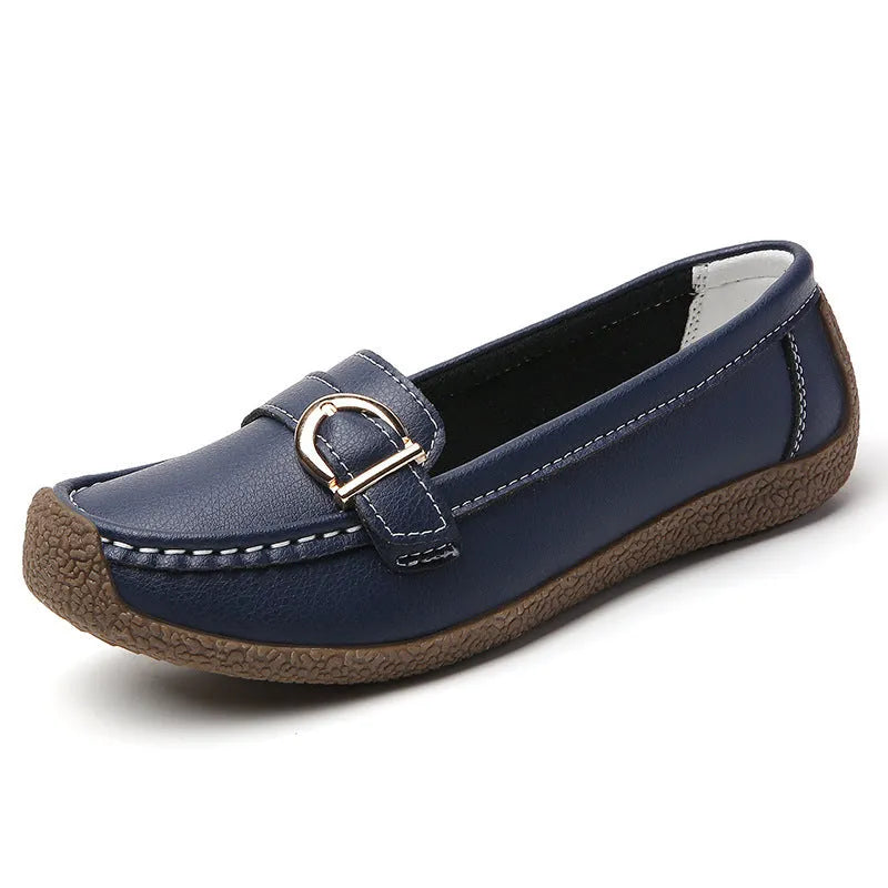 Women's beige casual loafers with round toe and flat heel on a white background.