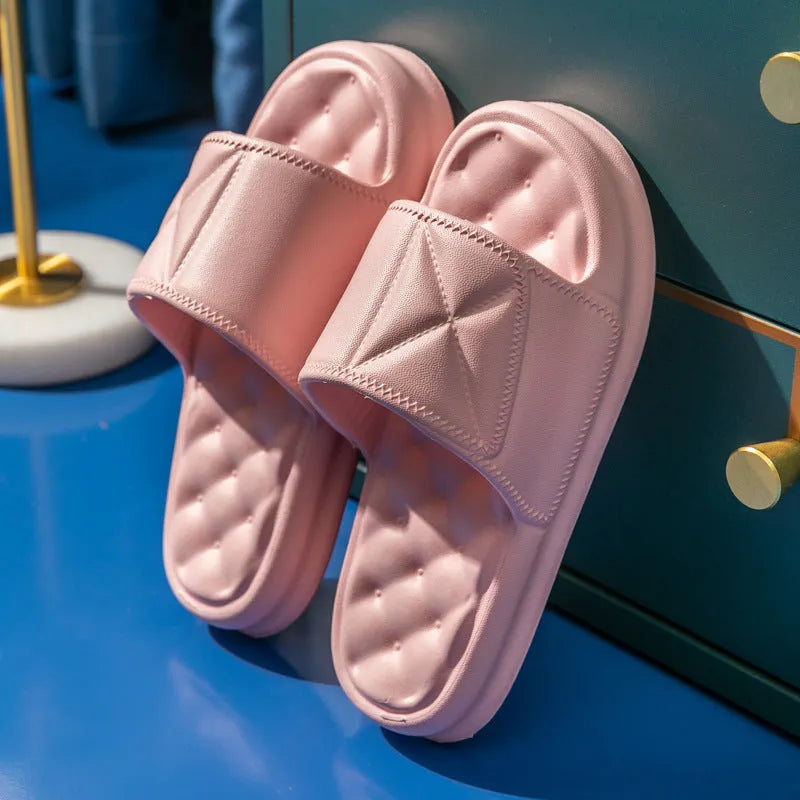 A pair of thick-soled EVA bathroom slippers in a selected colour, showing their injection-moulded non-slip design.