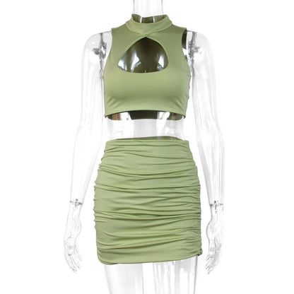 Light purple women's two-piece set featuring a hollow vest with cutouts and a high-waisted split skirt on a model.