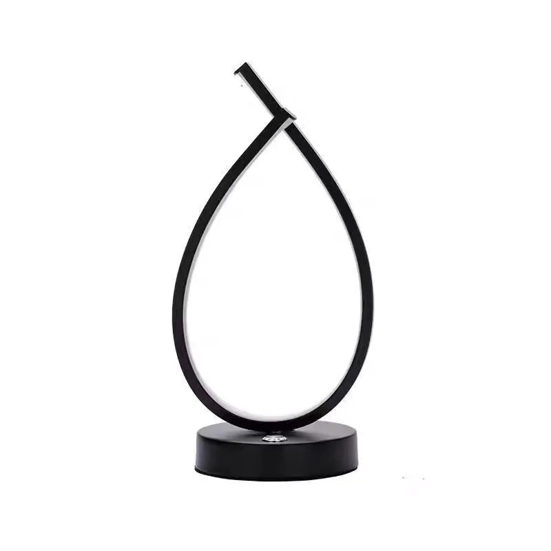 Black or white water drop shaped USB table lamp with touch control measuring 30cm tall