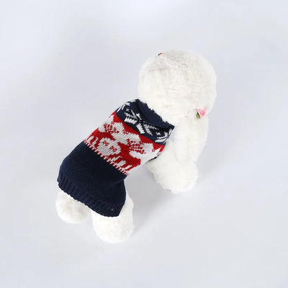 Navy blue knitted Christmas sweater for dogs on a festive background