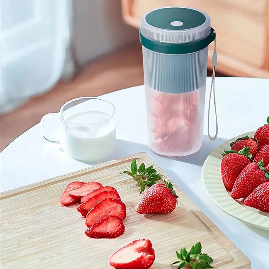 Portable USB rechargeable blender cup in blue, green, or pink with 300ml capacity and detachable blades