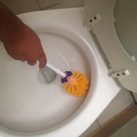 Yellow Donald Trump novelty toilet brush with hanging slot in handle