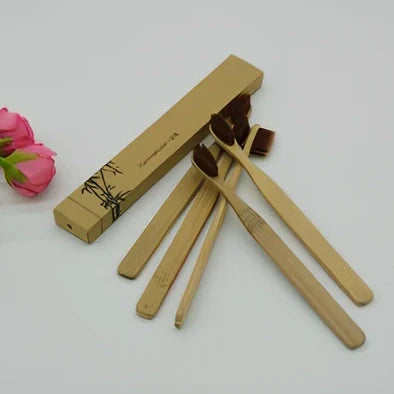 Organic bamboo toothbrush with 17.5cm ergonomic handle and charcoal-infused bristles for sustainable dental care