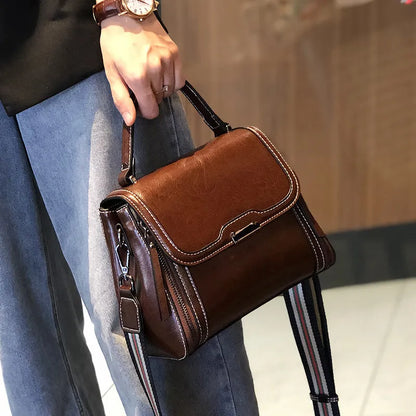 Women's genuine leather retro messenger bag in horizontal square shape with multiple internal compartments