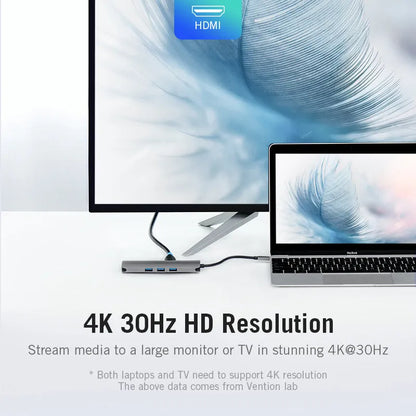Deep grey Type-C to HDMI, USB, Ethernet, and card reader hub with 0.15m cable on a laptop