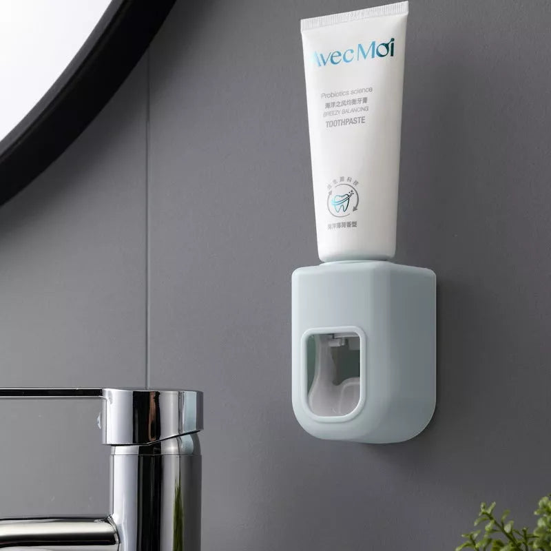 Nordic Automatic Toothpaste Dispenser in pink, blue, white, and gray options