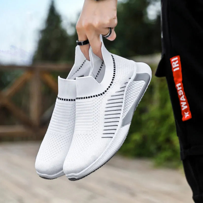 Men's black and white striped mesh slip-on sneakers with lace-up front.