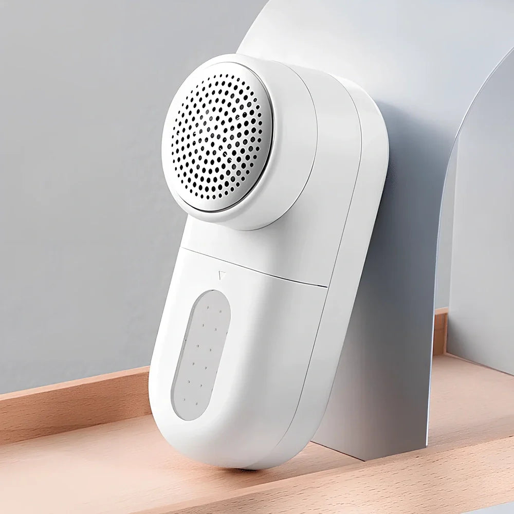 White plastic electric shaver with bulb removal function measuring 145mm length