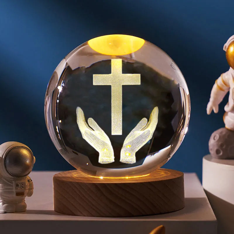 White crystal ball ornament with solid wood warm light base, showing purity engravings like Cross and Maria for desk decor