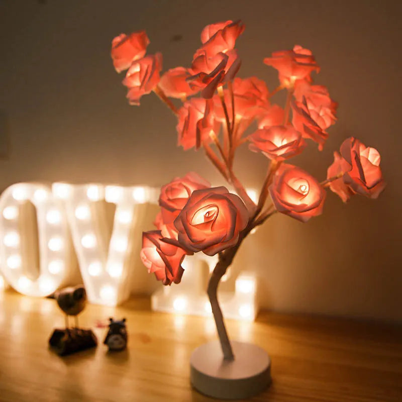 White and red rose flower LED lamp on a bonsai tree stand with warm white lights.