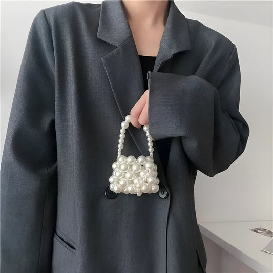 Women's imitation pearl mini crossbody handbag with geometric pattern in a pearl colour.