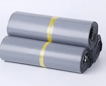 A pack of flat, sealed white PE plastic courier bags with an adhesive strip, showing size options and colour variations.