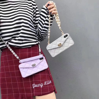 Luxury women's silicone iPhone case with pearl chain lanyard in beige, black, green, khaki, pink, or white