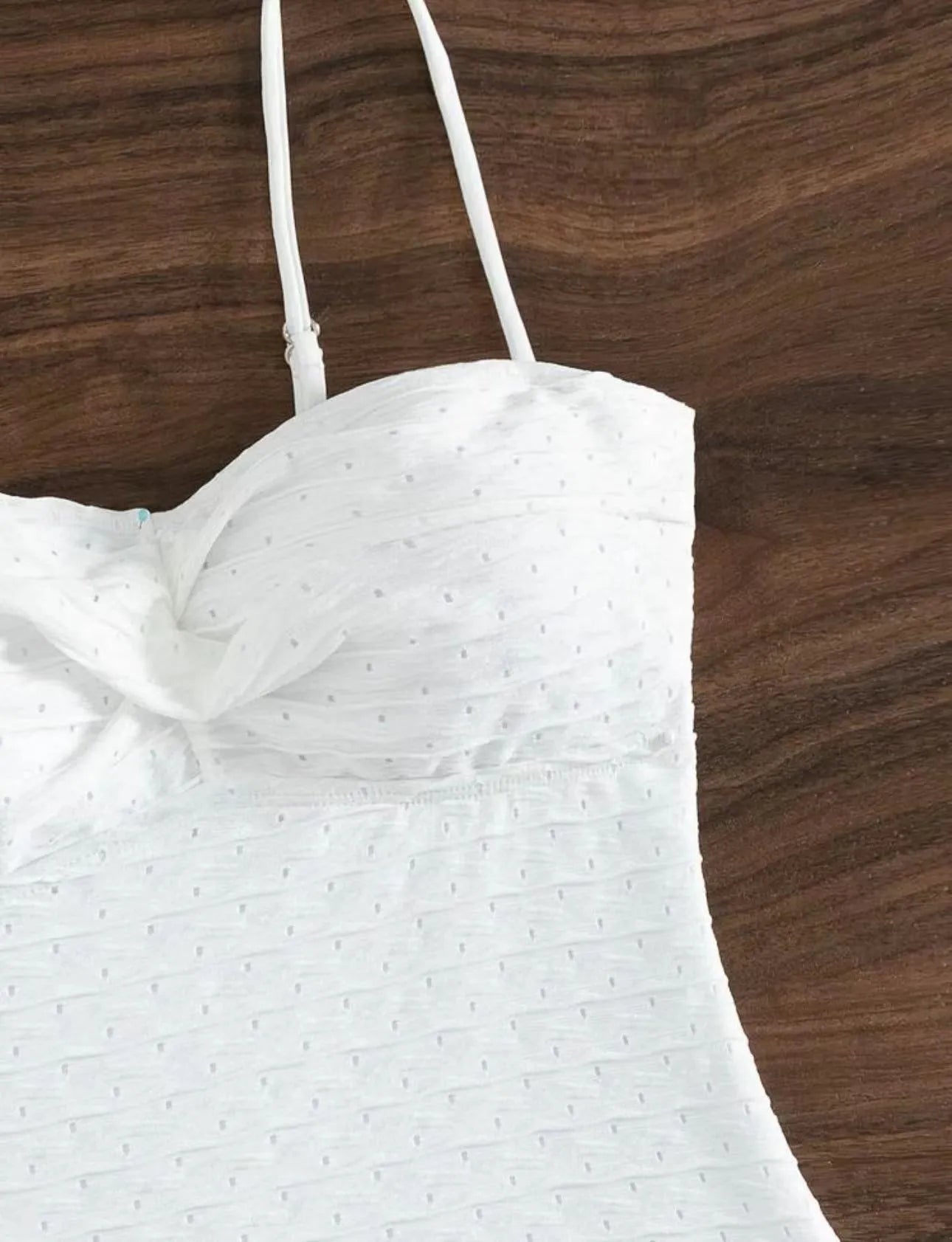 White women's one-piece swimsuit with sling design and solid colour pattern