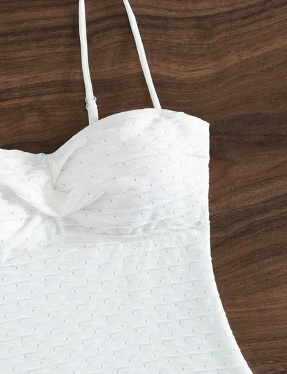 White women's one-piece swimsuit with sling design and solid colour pattern