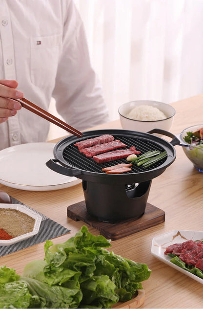Compact tabletop barbecue grill with dual alcohol burners, made of durable aluminum with a nonstick cooking surface