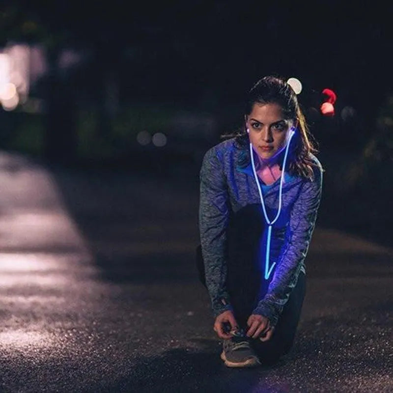 Blue Magic Light LED earphones with aluminium alloy shells and glowing EL lights, connected to a 3.5mm plug