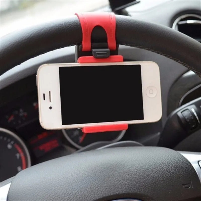 Black steering wheel phone holder with 75mm clip mounted on car wheel holding smartphone