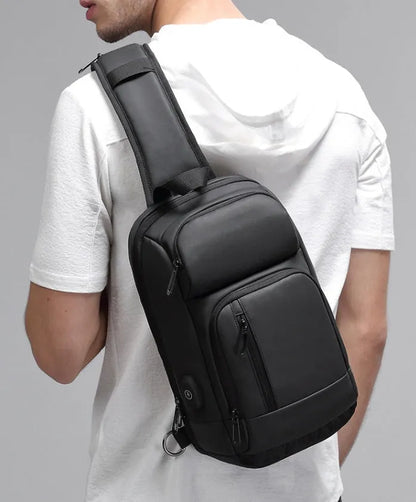 Black outdoor leisure shoulder bag with air cushion strap and multiple internal compartments