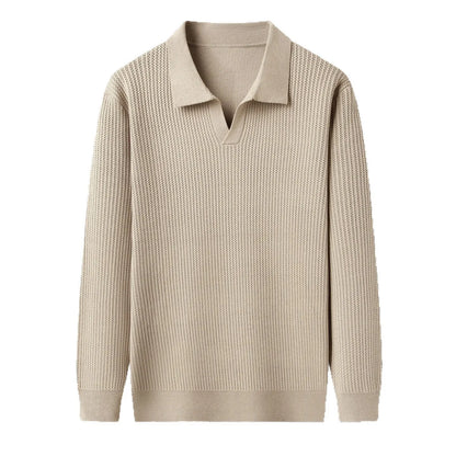 Man wearing a loose fit camel coloured pullover sweater, a casual autumn layer with a simple design.