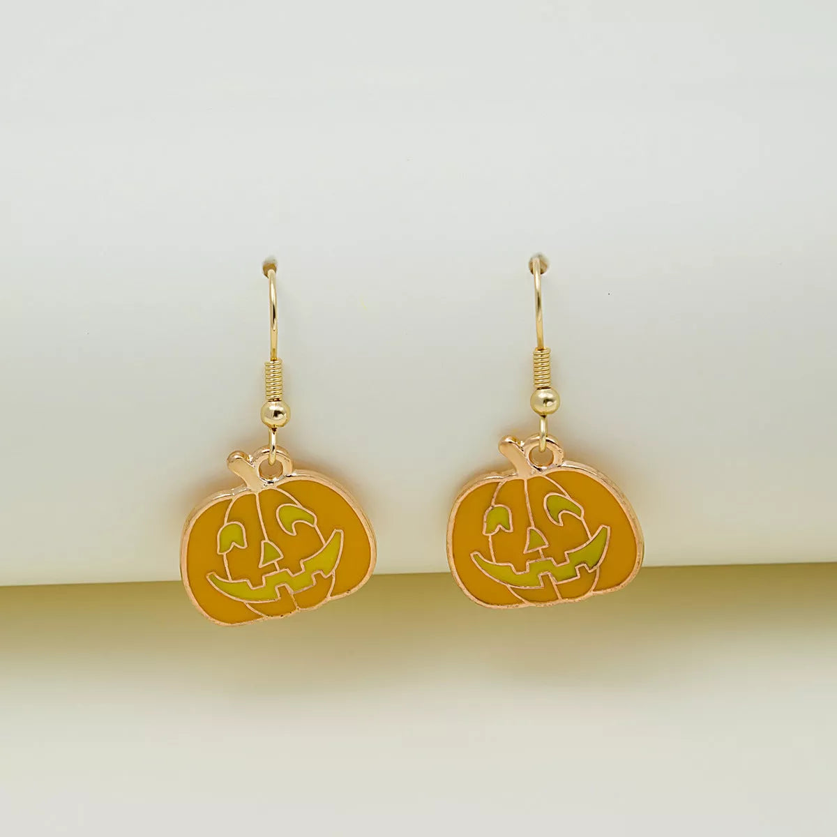 Halloween pumpkin oil drip alloy earrings with geometric design