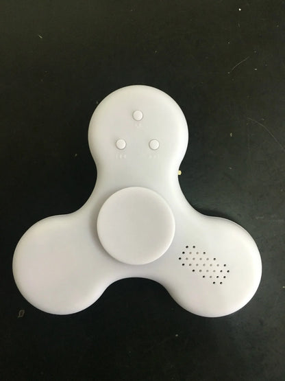 White Bluetooth speaker fidget spinner EDC toy with MP3 player functionality showing compact design