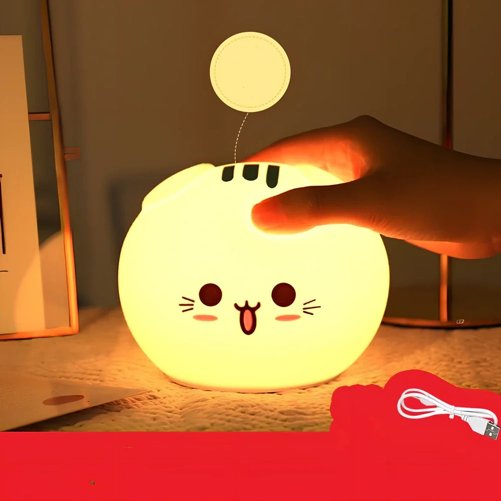 Silicone night light with fold-eared cat design showing LED illumination and USB charging port