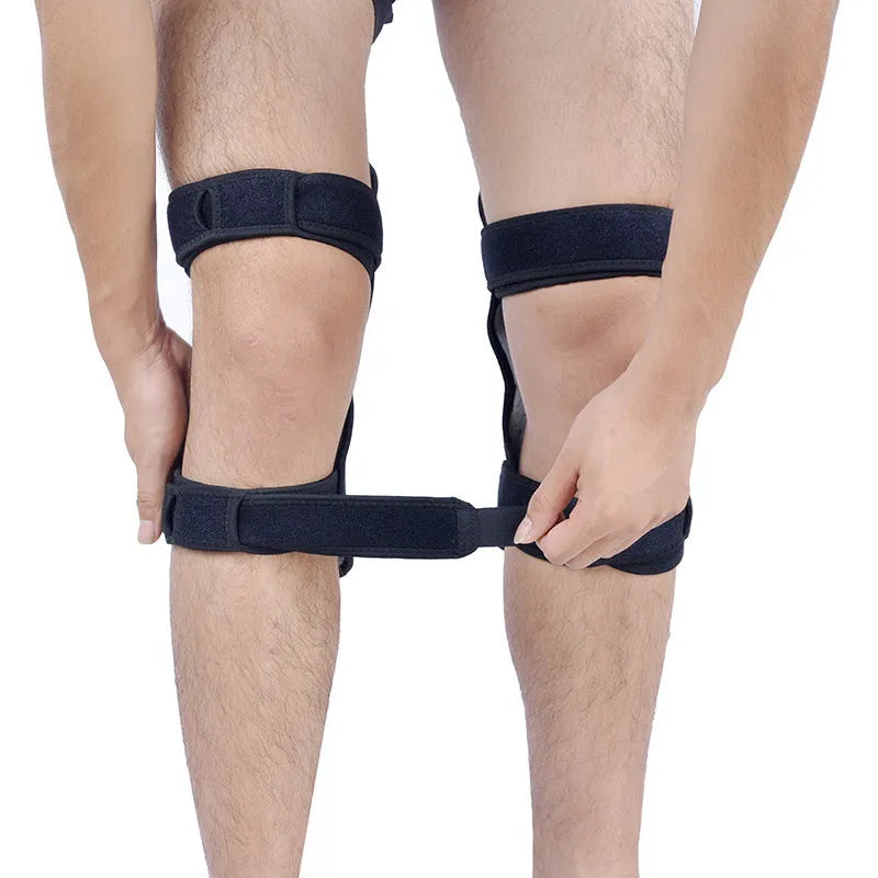 Adjustable spring knee brace for sports support in black, shown with straps.