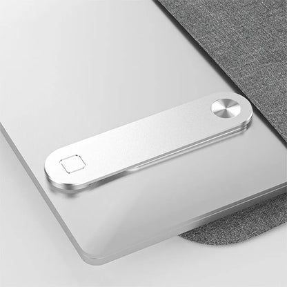Black laptop phone holder with magnetic clip mounted on silver laptop, showing smartphone in adjustable bracket