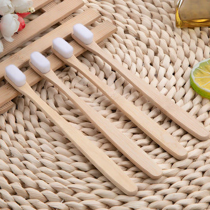 Bamboo toothbrush with wood colour handle measuring 18.5cm long with soft white bristles in protective tube