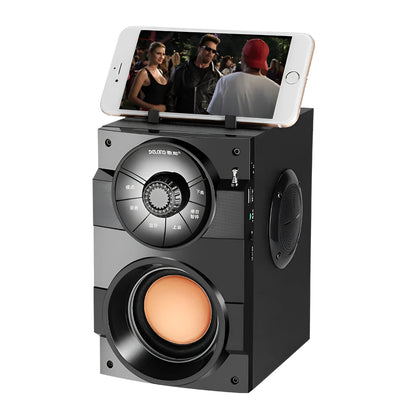 Black portable mini home audio system with built-in subwoofer, 3.5mm audio port, and USB charging cable