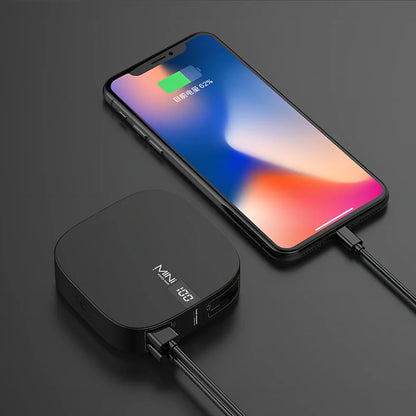 Red 10000 mAh mini power bank with digital display showing battery percentage, measuring 90x64x24mm