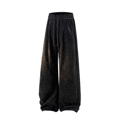 Straight-leg fleece-lined casual trousers in black on a hanger, showing elastic waistband.