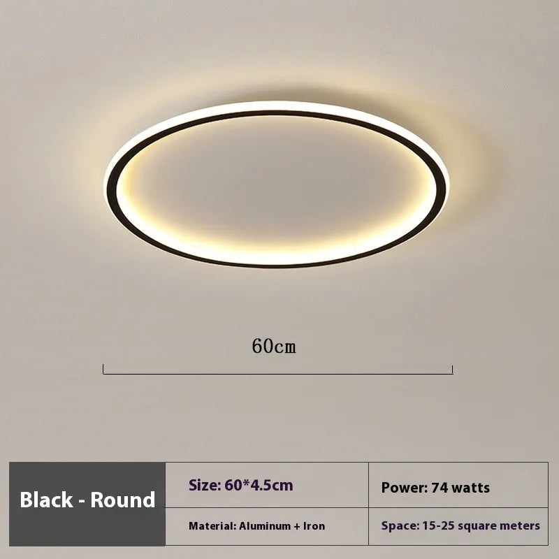 Minimalist circular ceiling lamp in gold finish mounted on a white ceiling