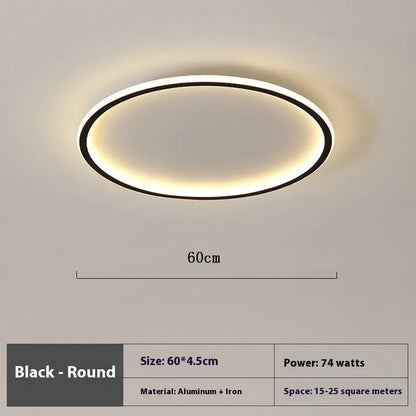 Minimalist circular ceiling lamp in gold finish mounted on a white ceiling