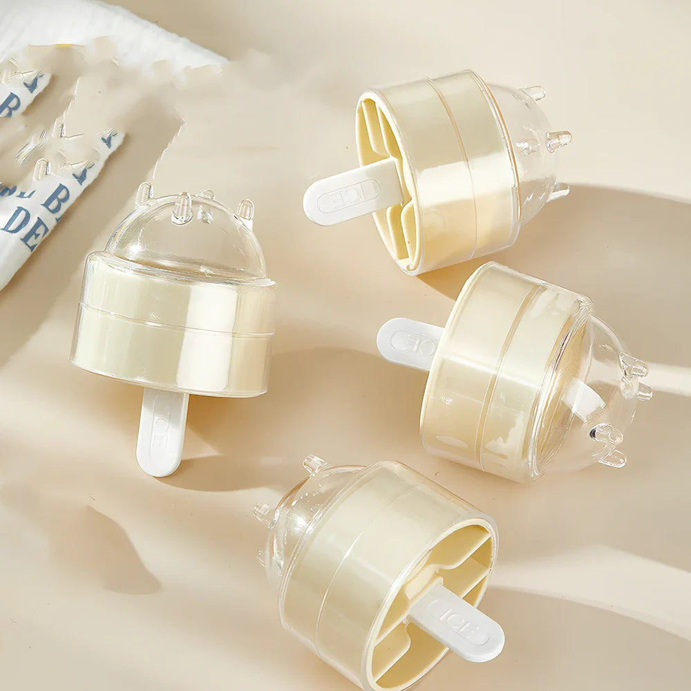 Four colourful lollipop-shaped silicone ice moulds showing creamy yellow, pink, blue, and yellow options